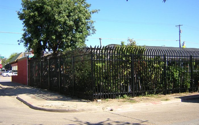 9-foot Ameristar Gauntlet high-security anti-climb steel fence installed by 78 Fence on a commercial property